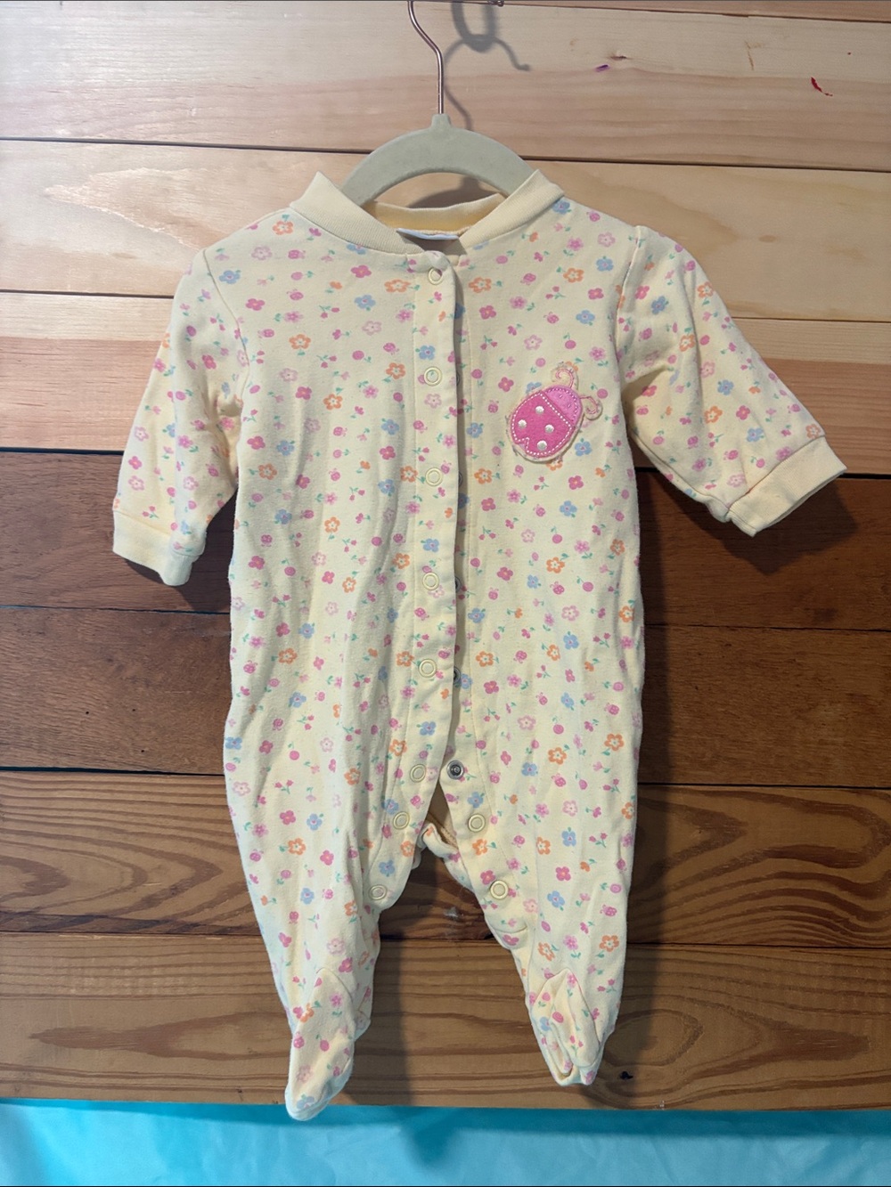 child of mine Pale Yellow Floral Footed One-Piece with Pink Patch